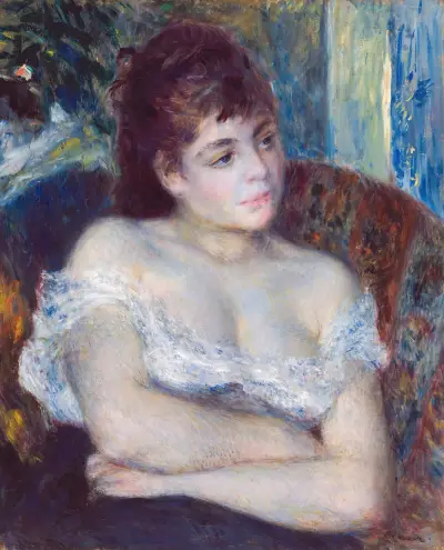 Kvinna i fåtölj av Pierre-Auguste Renoir