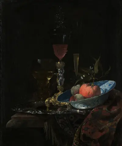 Weinglas und eine Obstschale von Willem Kalf