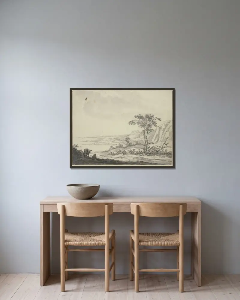 Bergslandskap vid havet, till vänster en sittande man vid en åsna av Aelbert Cuyp inramad på en vägg