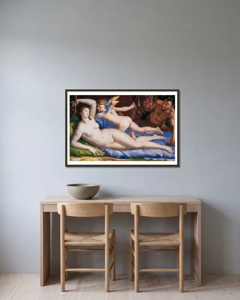 Venus, Cupid And Satyr av Agnolo Bronzino inramad på en vägg