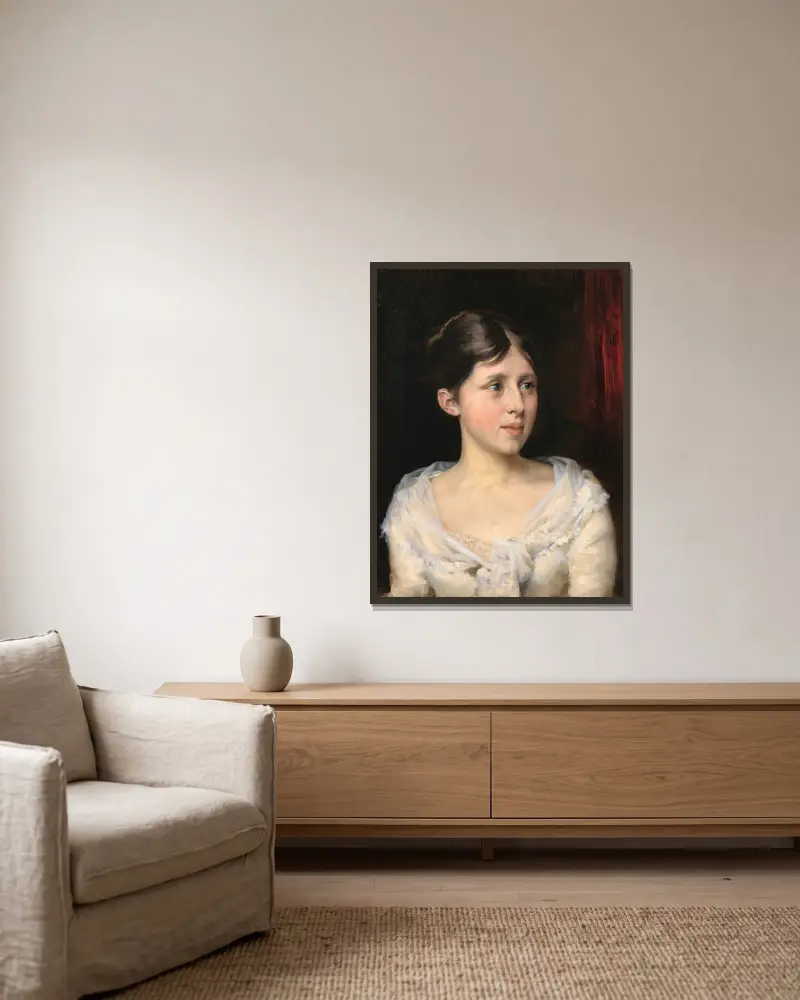Flicka i vit klänning av Albert Edelfelt inramad på en vägg