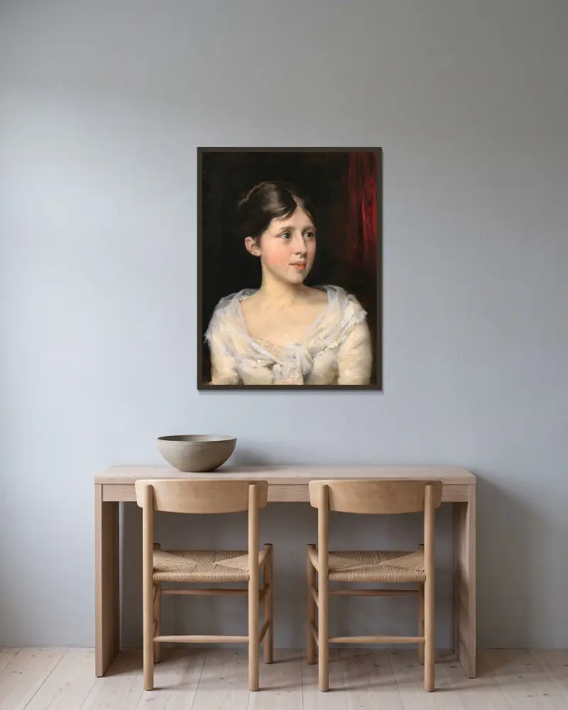 Flicka i vit klänning av Albert Edelfelt inramad på en vägg