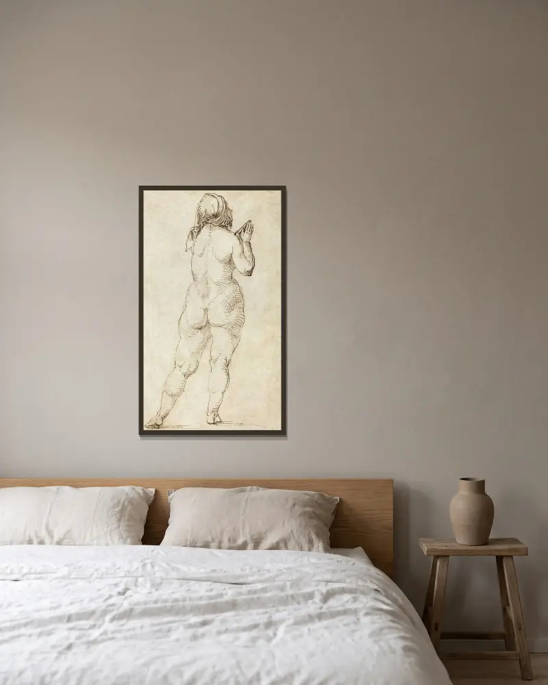 Naken kvinna i bön av Albrecht Dürer inramad på en vägg