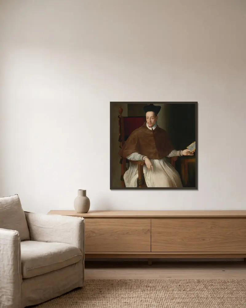 Bildnis eines Geistlichen von Alessandro Allori gerahmt an einer Wand