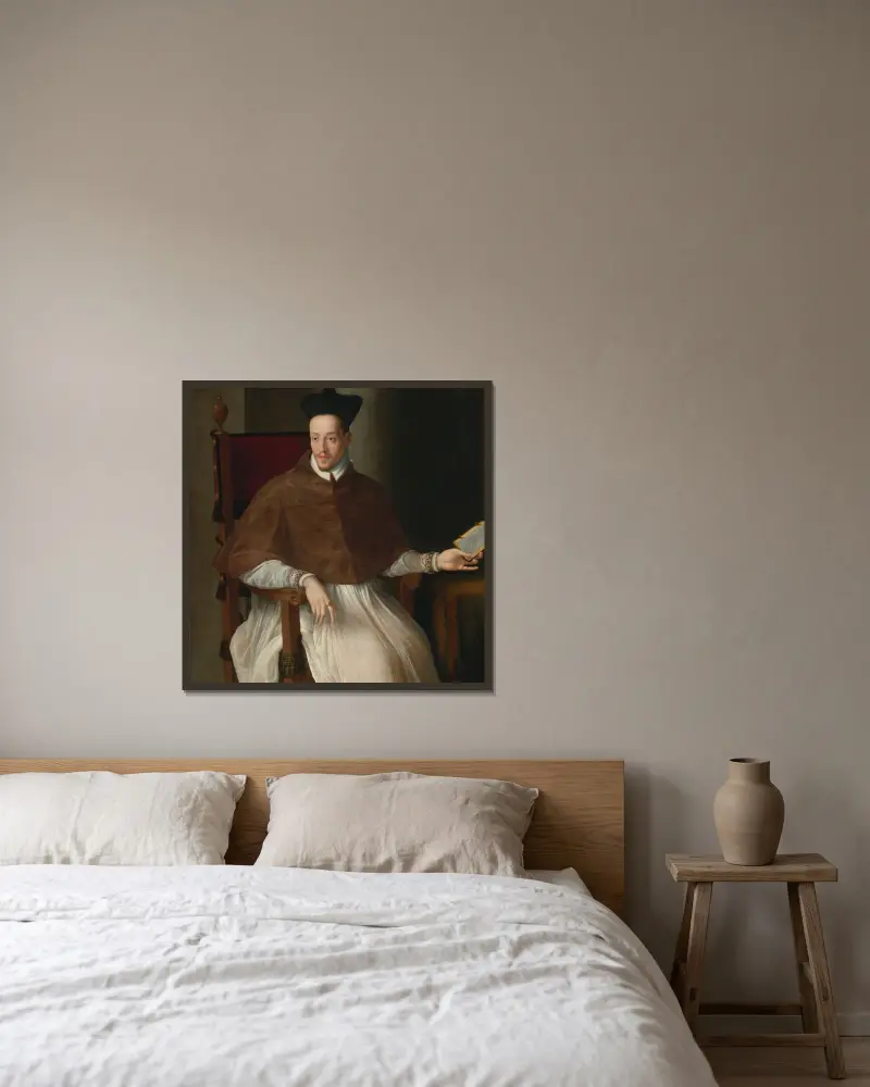 Bildnis eines Geistlichen von Alessandro Allori gerahmt an einer Wand