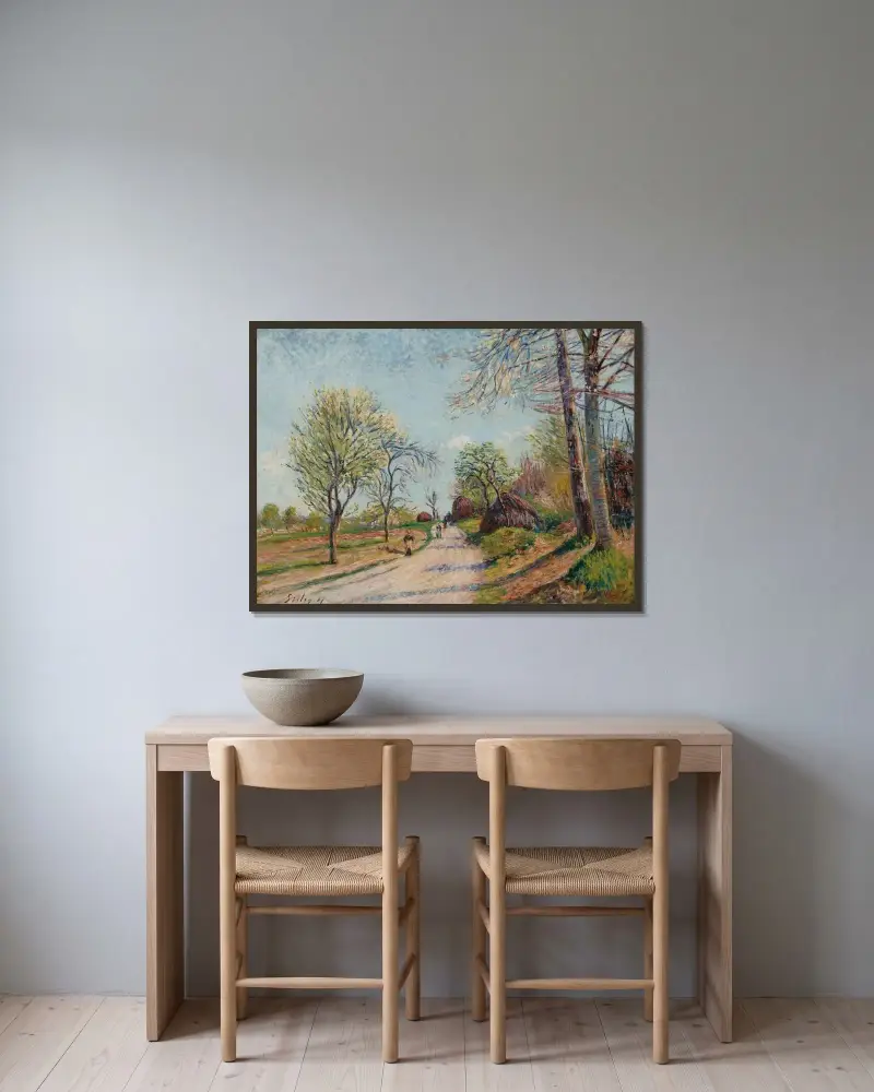 La route de Veneux av Alfred Sisley inramad på en vägg