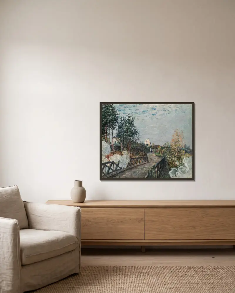 Le pont du chemin de fer av Alfred Sisley inramad på en vägg