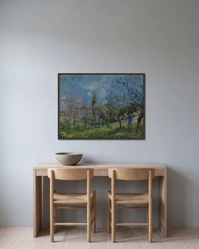 Orchard in Spring av Alfred Sisley inramad på en vägg