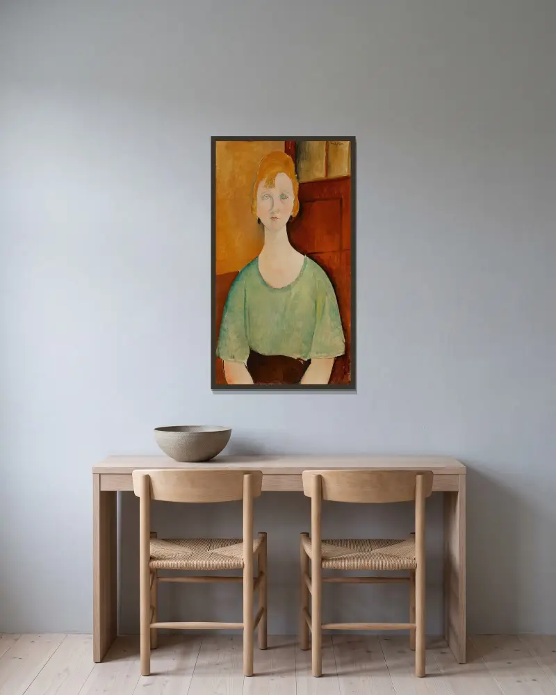 Flicka i grön blus av Amedeo Modigliani inramad på en vägg