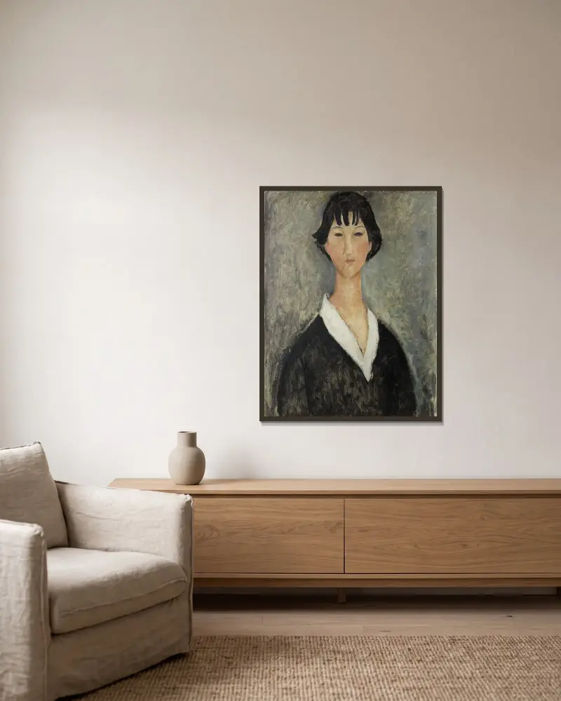Mädchen mit schwarzen Haaren von Amedeo Modigliani gerahmt an einer Wand