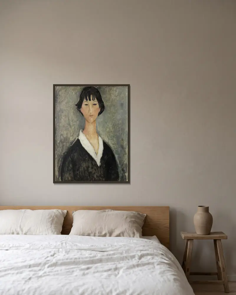 Mädchen mit schwarzen Haaren von Amedeo Modigliani gerahmt an einer Wand