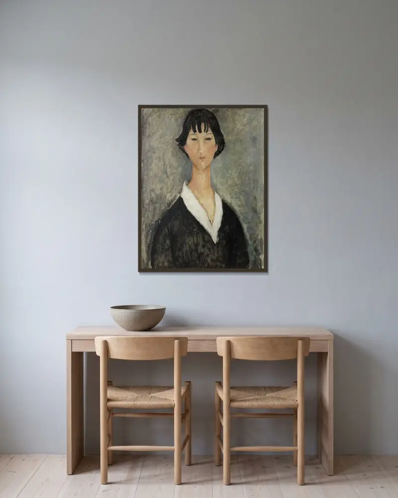 Mädchen mit schwarzen Haaren von Amedeo Modigliani gerahmt an einer Wand