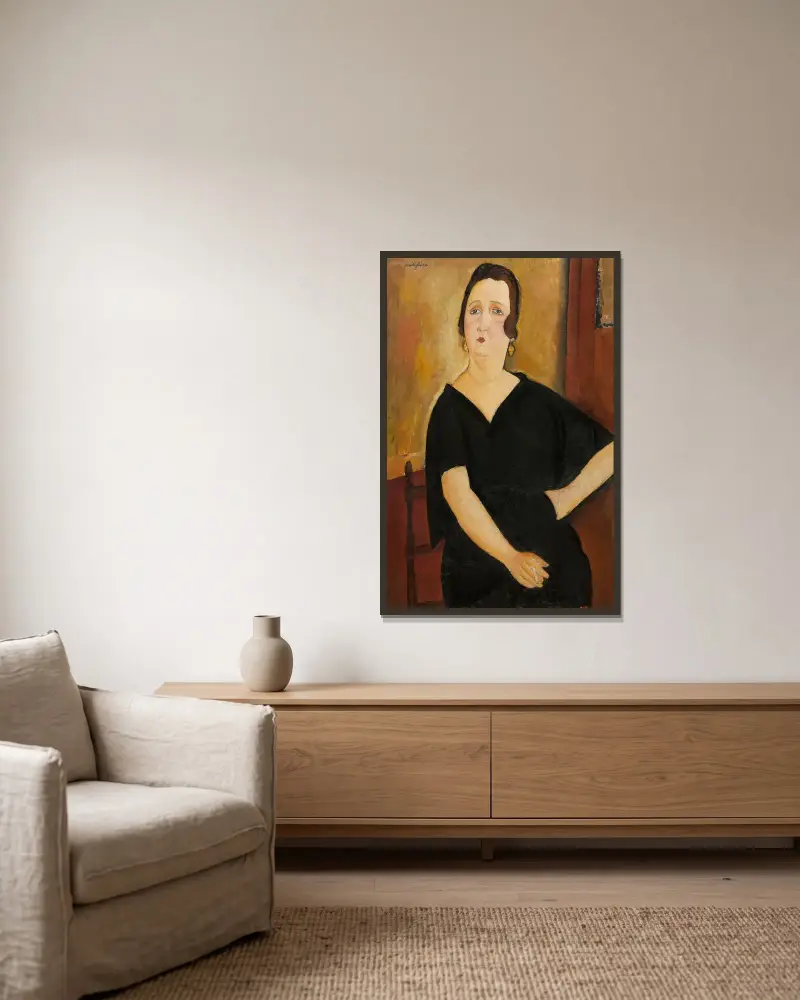 Madame Amédée (Frau mit Zigarette) von Amedeo Modigliani gerahmt an einer Wand