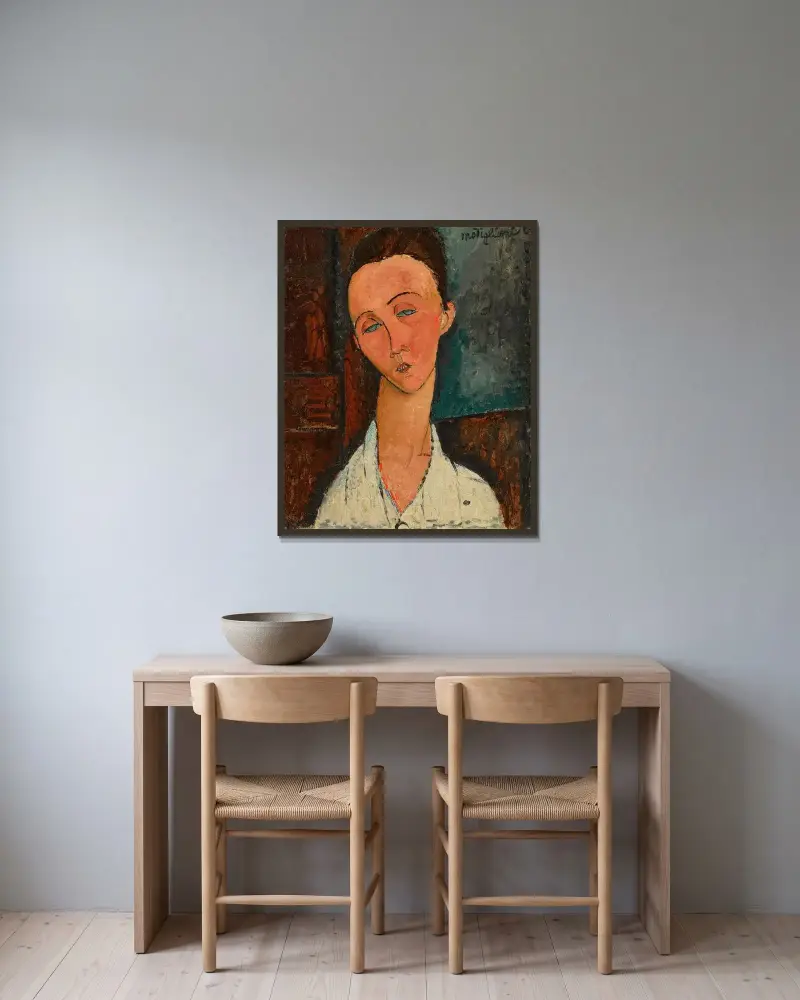 Portrait de Lunia Czechowska av Amedeo Modigliani inramad på en vägg