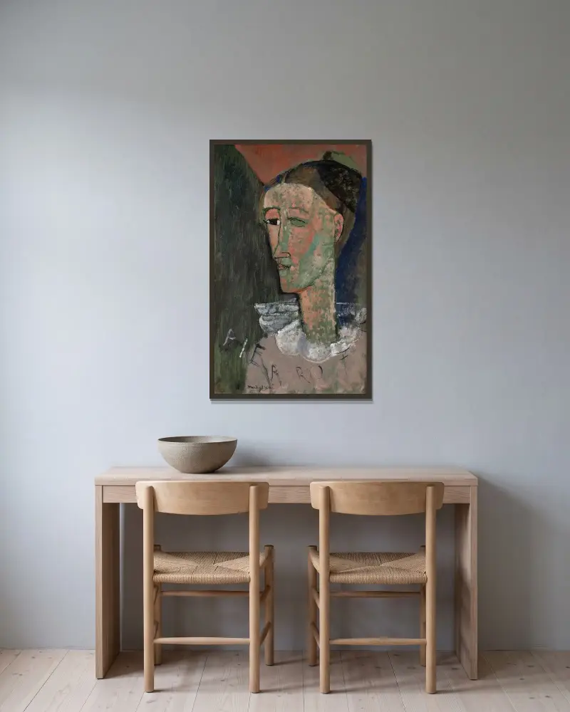 Self-Portrait as Pierrot av Amedeo Modigliani inramad på en vägg