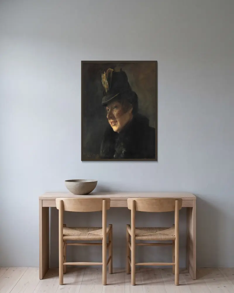 Porträtt av en ung kvinna i kappa med pälskrage och hatt med slöja av Laurits Andersen Ring inramad på en vägg