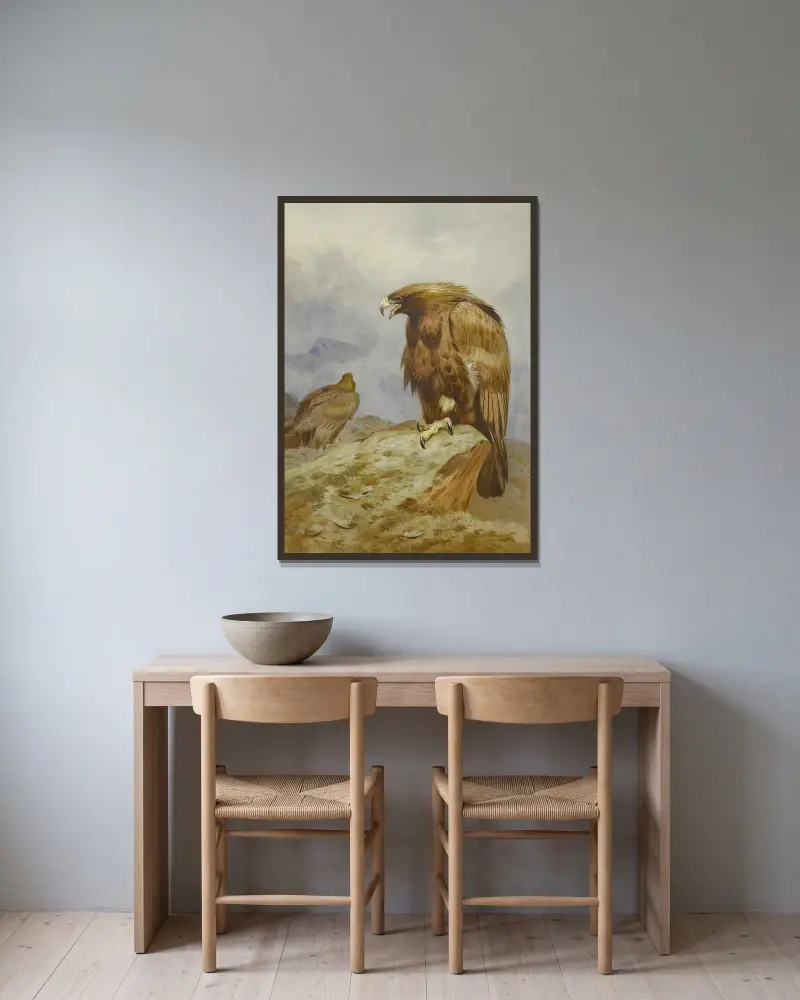 Ett par kungsörnar av Archibald Thorburn inramad på en vägg