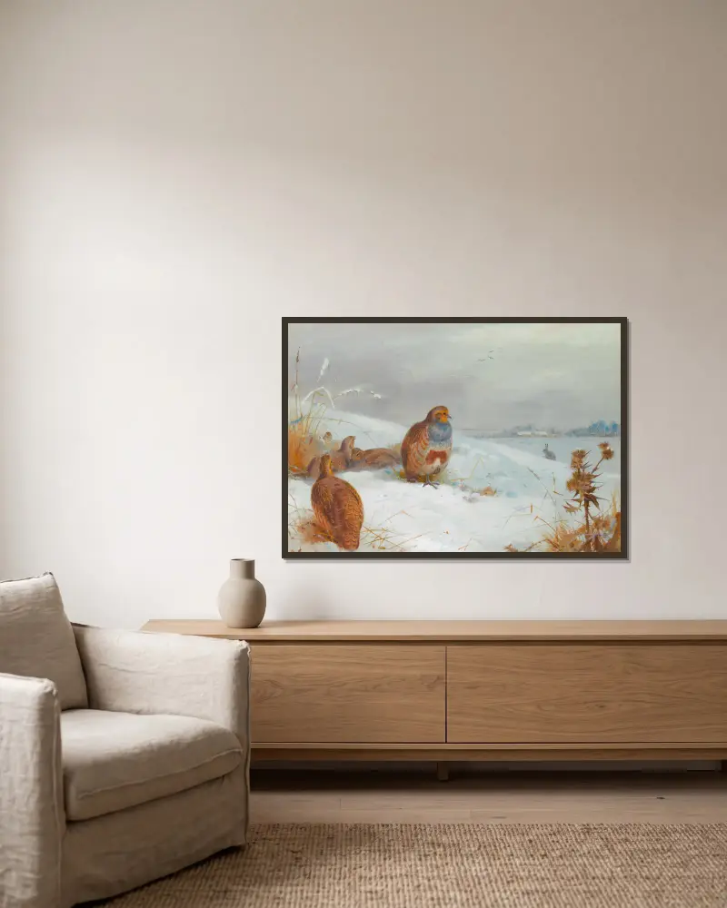 Harte Zeiten – Rebhühner und ein Hase von Archibald Thorburn gerahmt an einer Wand