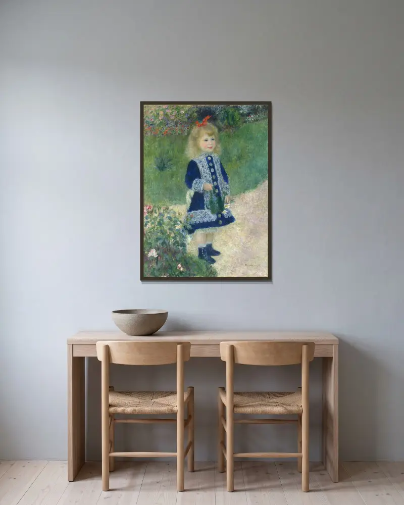 Mädchen mit Gießkanne von Pierre-Auguste Renoir gerahmt an einer Wand