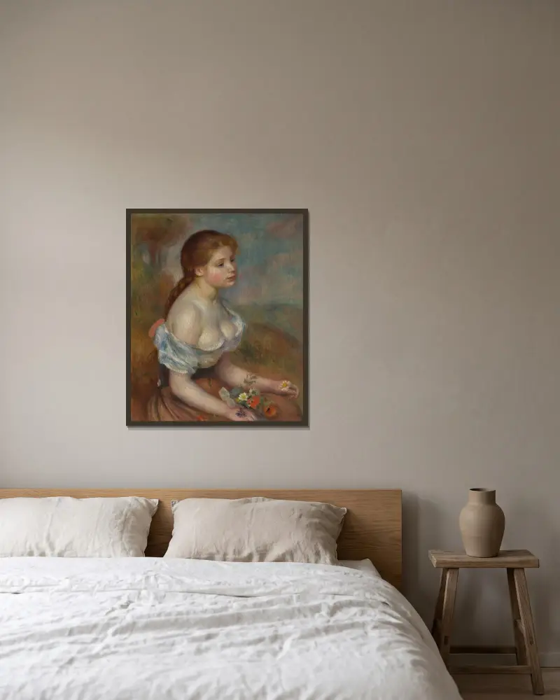 Ung flicka med prästkragar av Pierre-Auguste Renoir inramad på en vägg