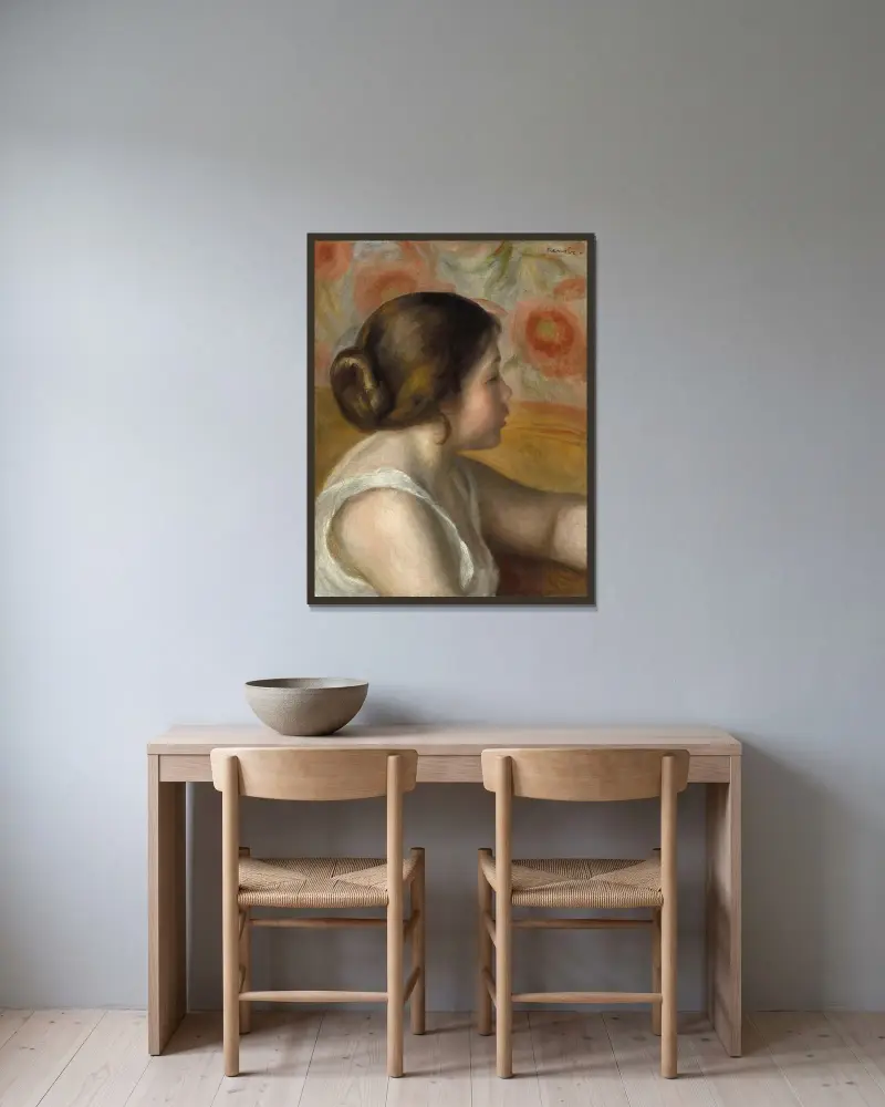 Huvud av en ung flicka av Pierre-Auguste Renoir inramad på en vägg