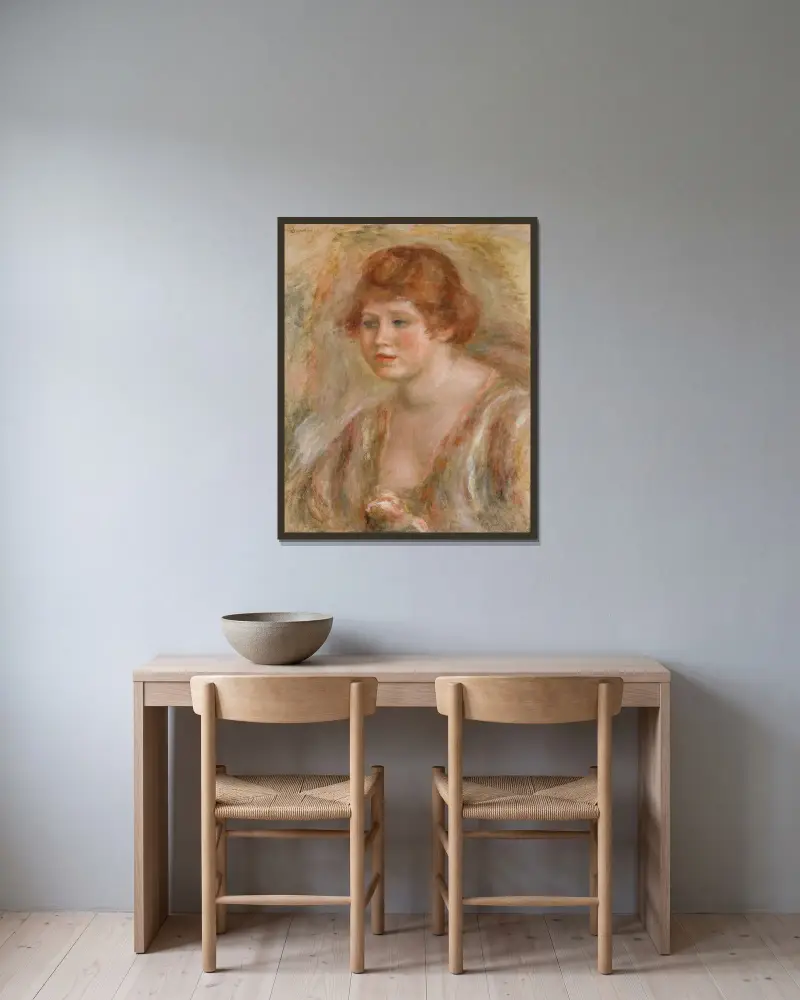 Ung kvinna med ros av Pierre-Auguste Renoir inramad på en vägg
