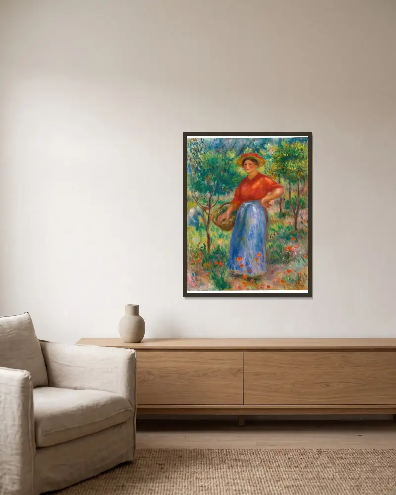 Ung flicka med korg (Gabrielle i trädgården) av Pierre-Auguste Renoir inramad på en vägg