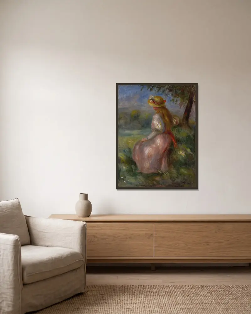 Flicka i rosa av Pierre-Auguste Renoir inramad på en vägg