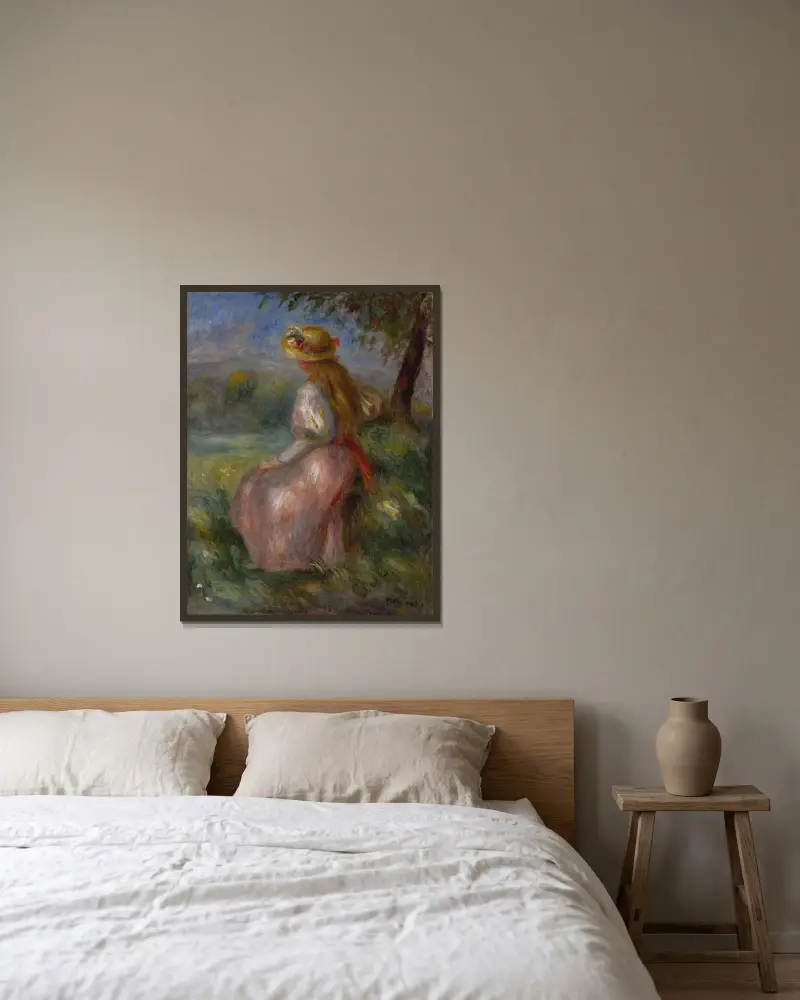 Flicka i rosa av Pierre-Auguste Renoir inramad på en vägg