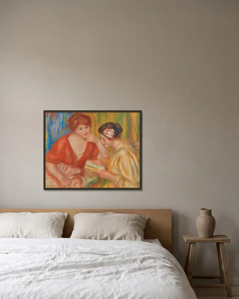 Die Lektüre, zwei Frauen in roten und rosa Blusen von Pierre-Auguste Renoir gerahmt an einer Wand