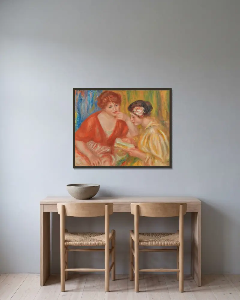Die Lektüre, zwei Frauen in roten und rosa Blusen von Pierre-Auguste Renoir gerahmt an einer Wand