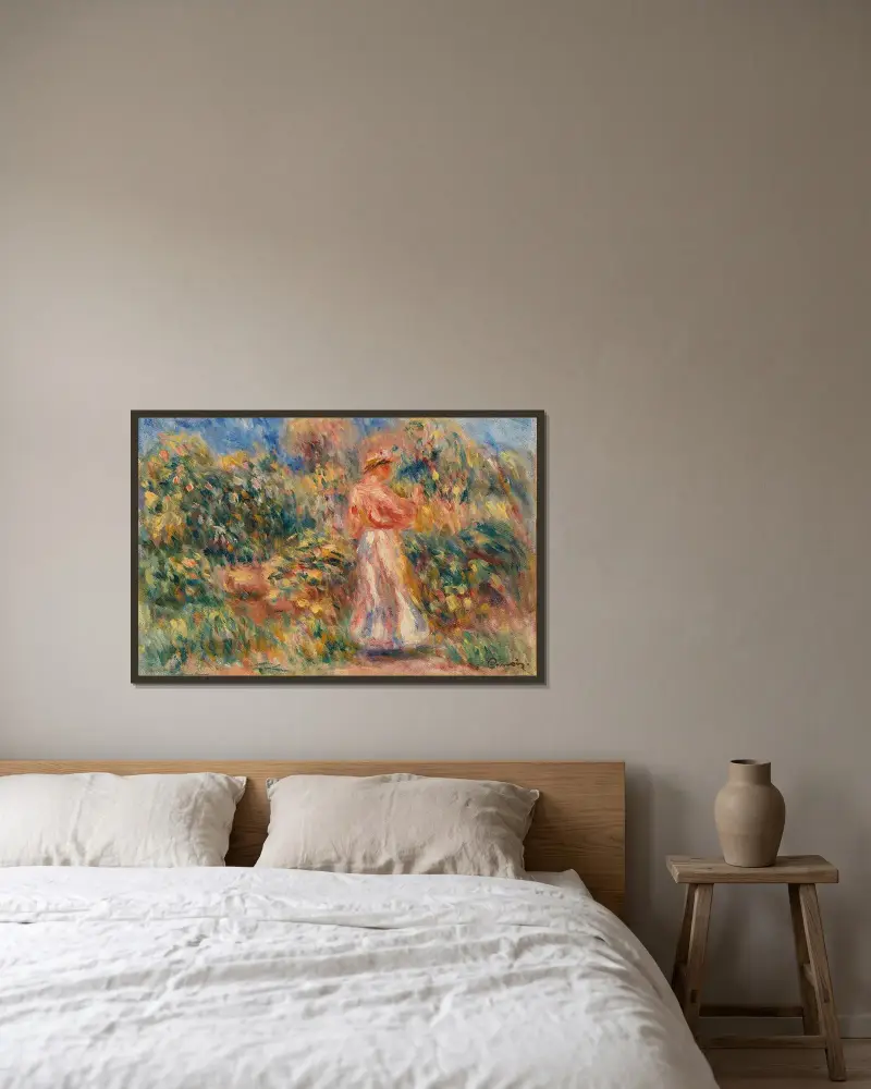 Landskap med kvinna i rosa och vitt av Pierre-Auguste Renoir inramad på en vägg