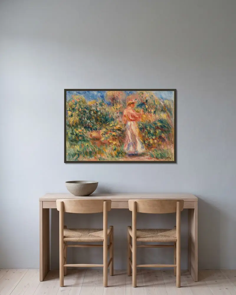 Landskap med kvinna i rosa och vitt av Pierre-Auguste Renoir inramad på en vägg