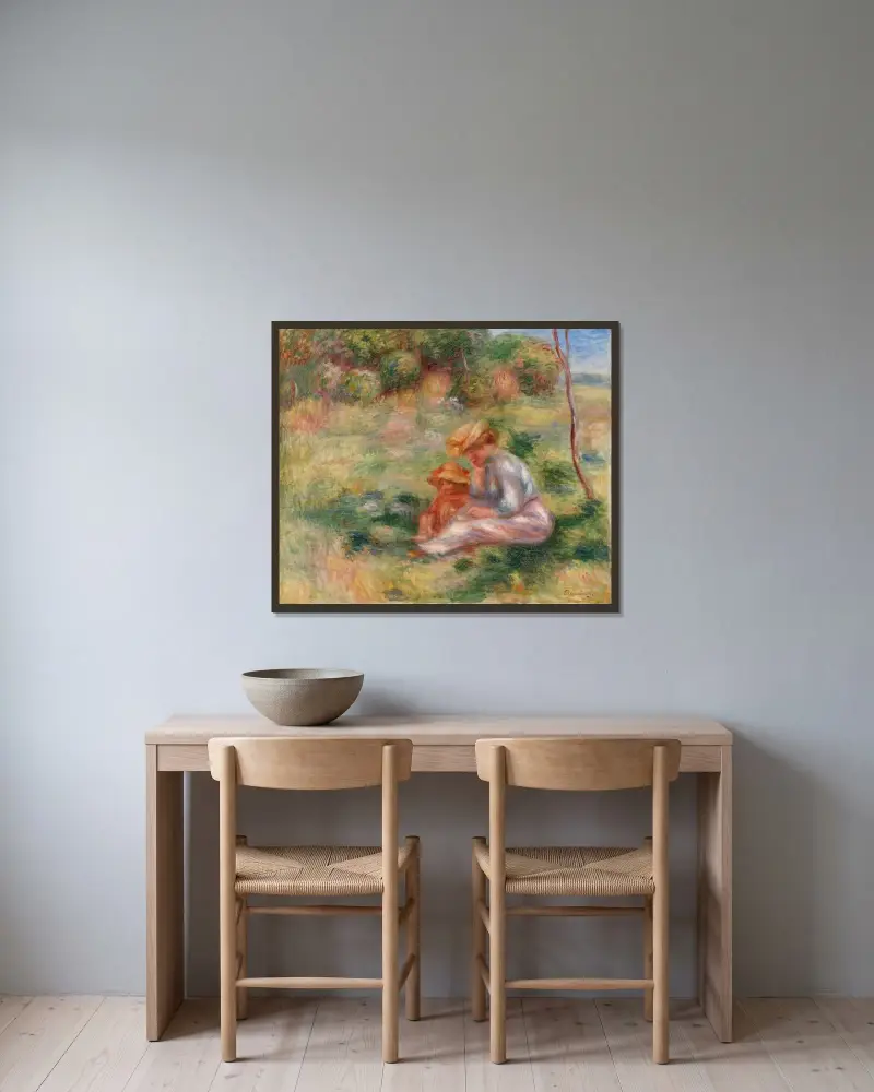 Kvinna och barn i gräset av Pierre-Auguste Renoir inramad på en vägg