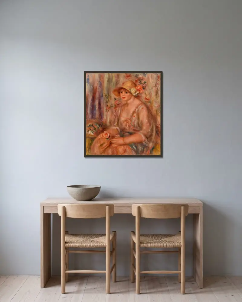 Kvinna i muslinklänning av Pierre-Auguste Renoir inramad på en vägg