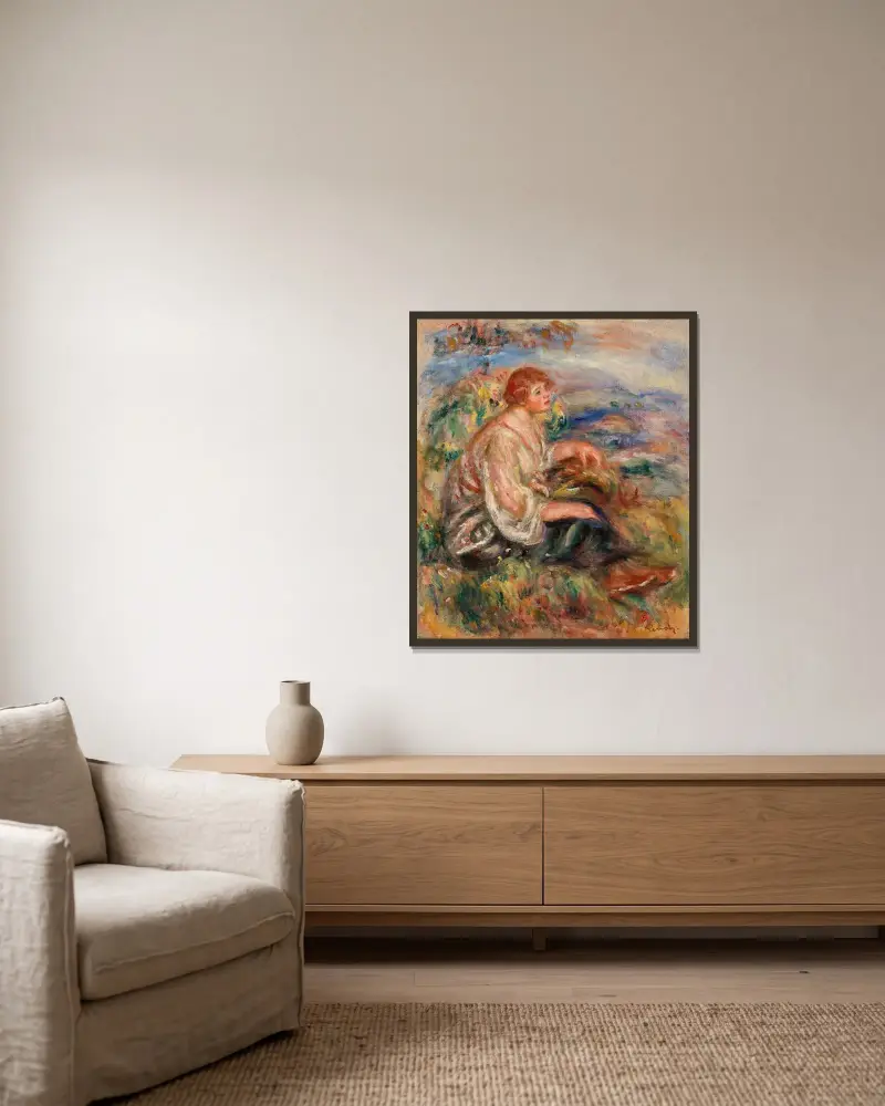 Frau in Tüllbluse und schwarzem Rock in einer Landschaft von Pierre-Auguste Renoir gerahmt an einer Wand