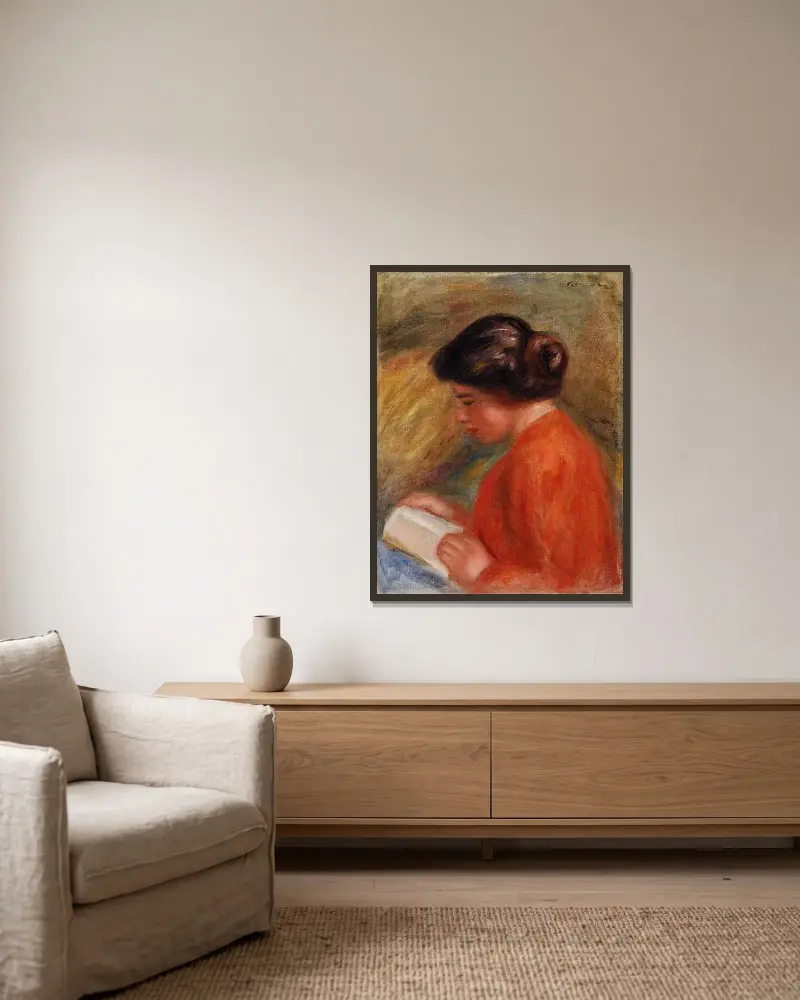 Young Woman Reading (Jeune femme lisant, buste) av Pierre-Auguste Renoir inramad på en vägg
