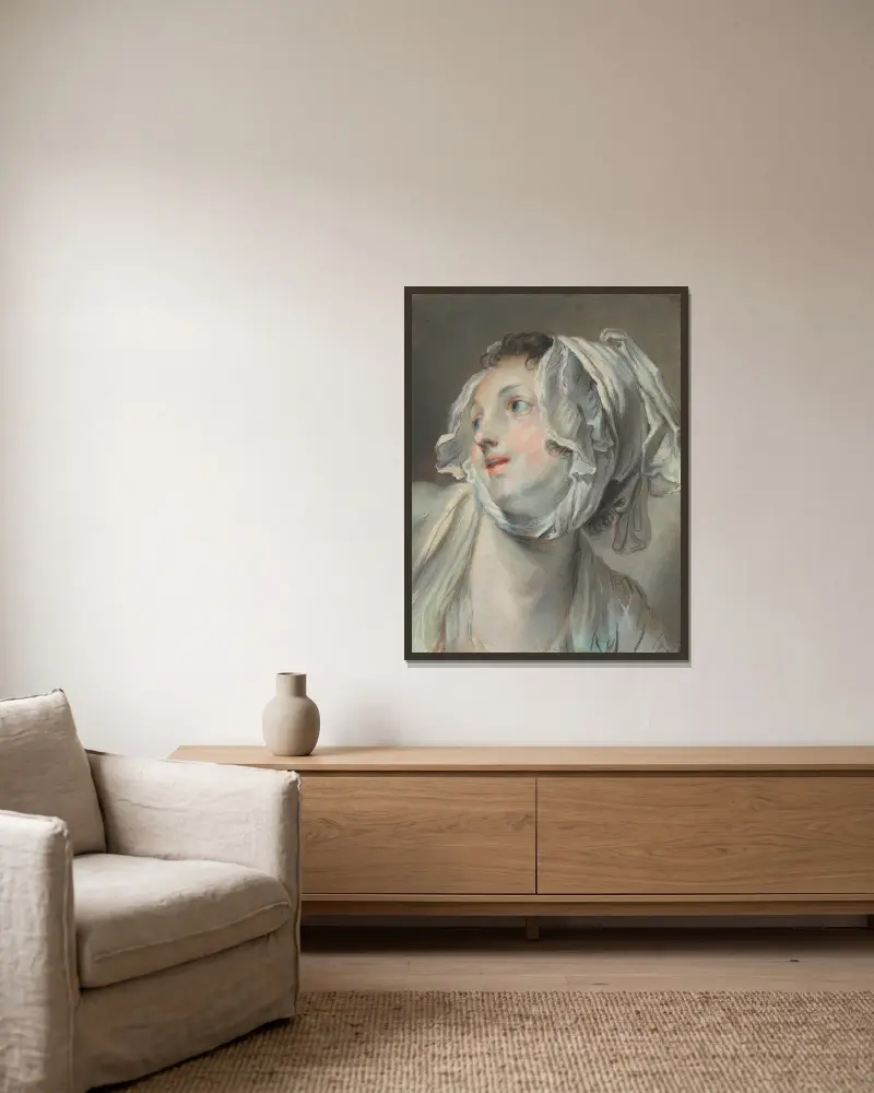 Huvud av en ung kvinna med mössa, vänd åt vänster av Jean-Baptiste Greuze inramad på en vägg