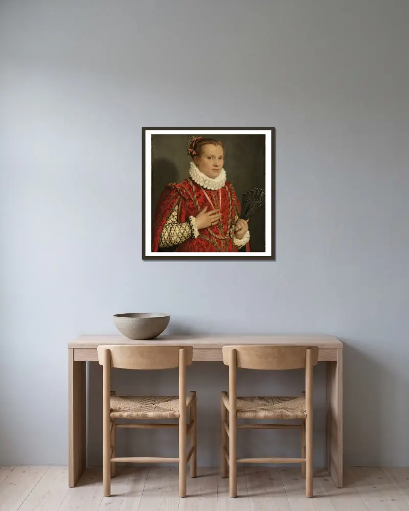 Porträtt av en ung kvinna av Giovanni Battista Moroni inramad på en vägg