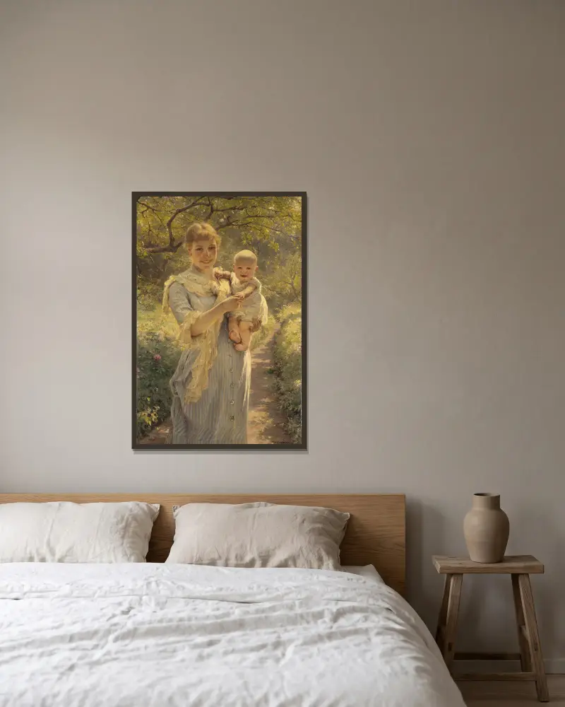 Ung mor med barn i trädgård av Bertha Wegmann inramad på en vägg