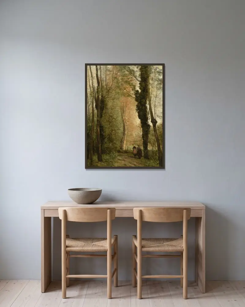 En väg under träden om våren av Jean-Baptiste-Camille Corot inramad på en vägg