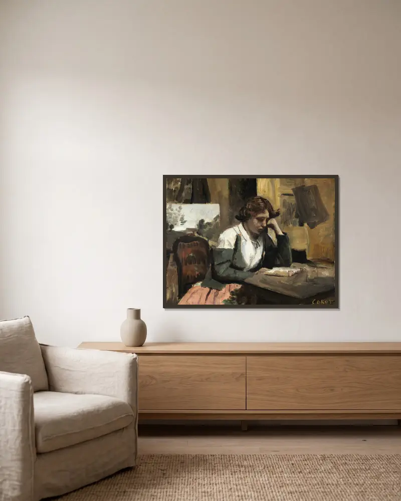 Kvinna som läser i ateljén av Jean-Baptiste-Camille Corot inramad på en vägg
