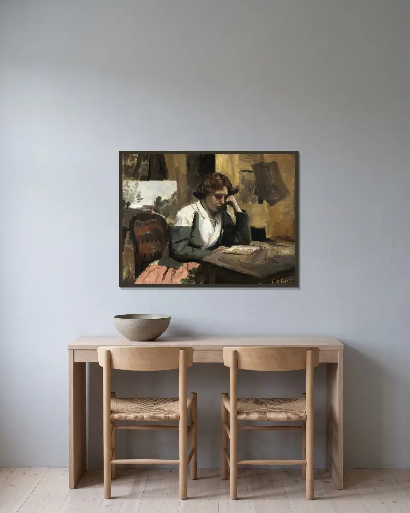 Kvinna som läser i ateljén av Jean-Baptiste-Camille Corot inramad på en vägg