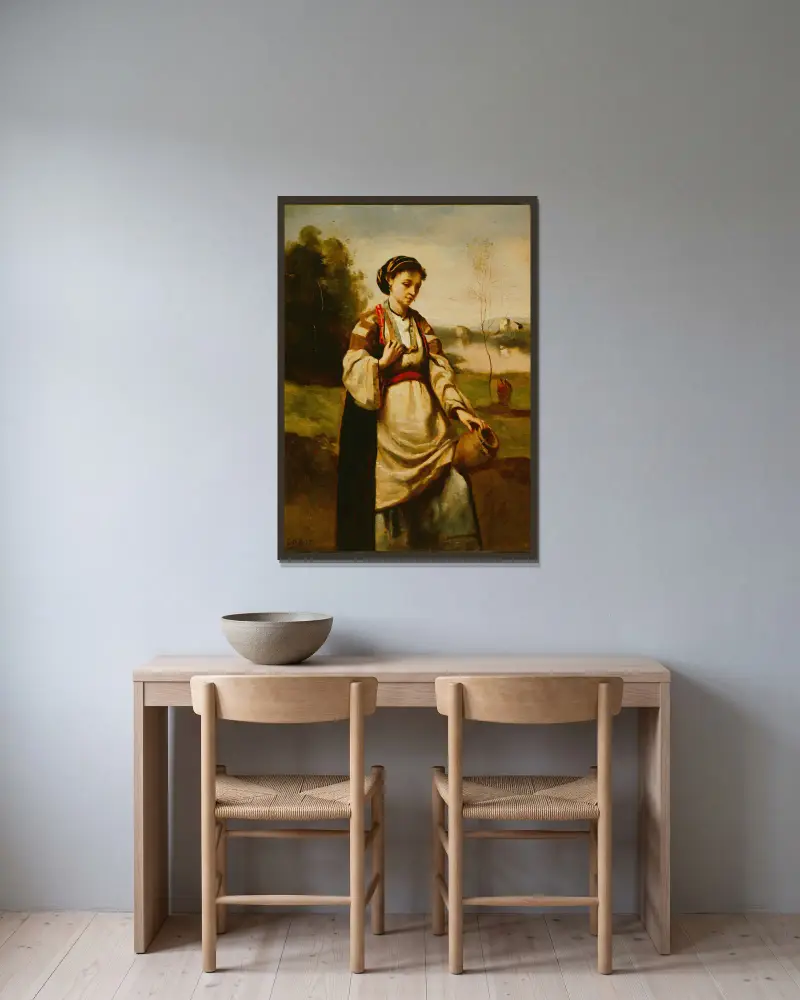 Kvinna med vattenkruka av Jean-Baptiste-Camille Corot inramad på en vägg