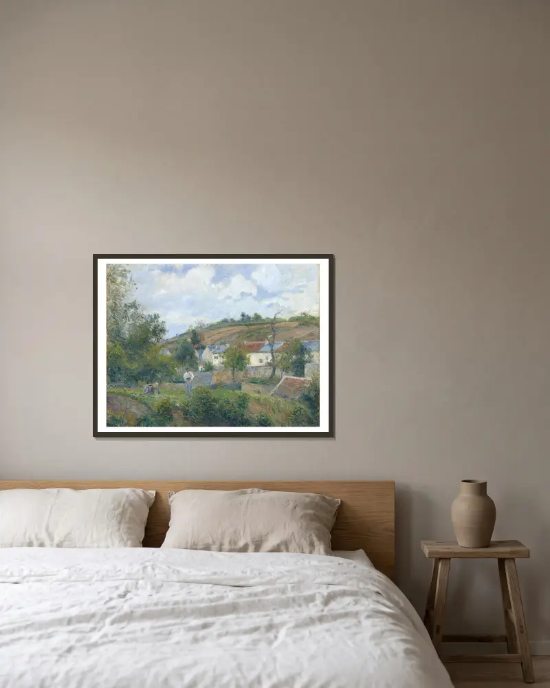 A Corner of l’Hermitage, Pontoise av Camille Pissarro inramad på en vägg