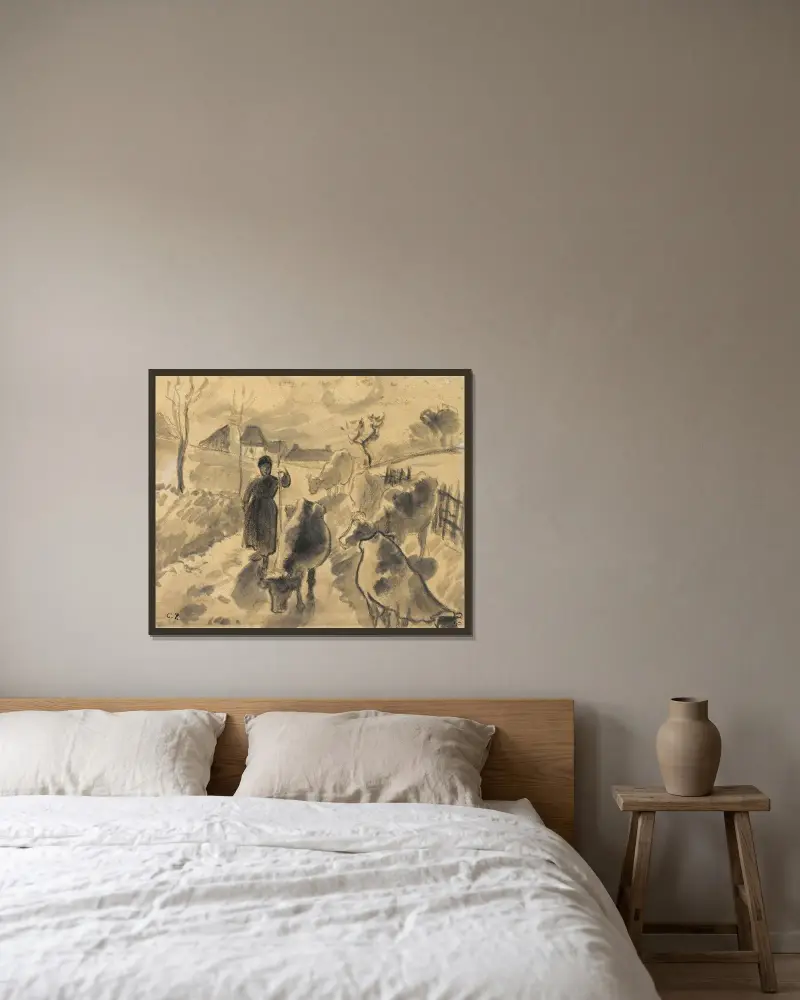 Flicka driver en hjord kor längs en väg av Camille Pissarro inramad på en vägg