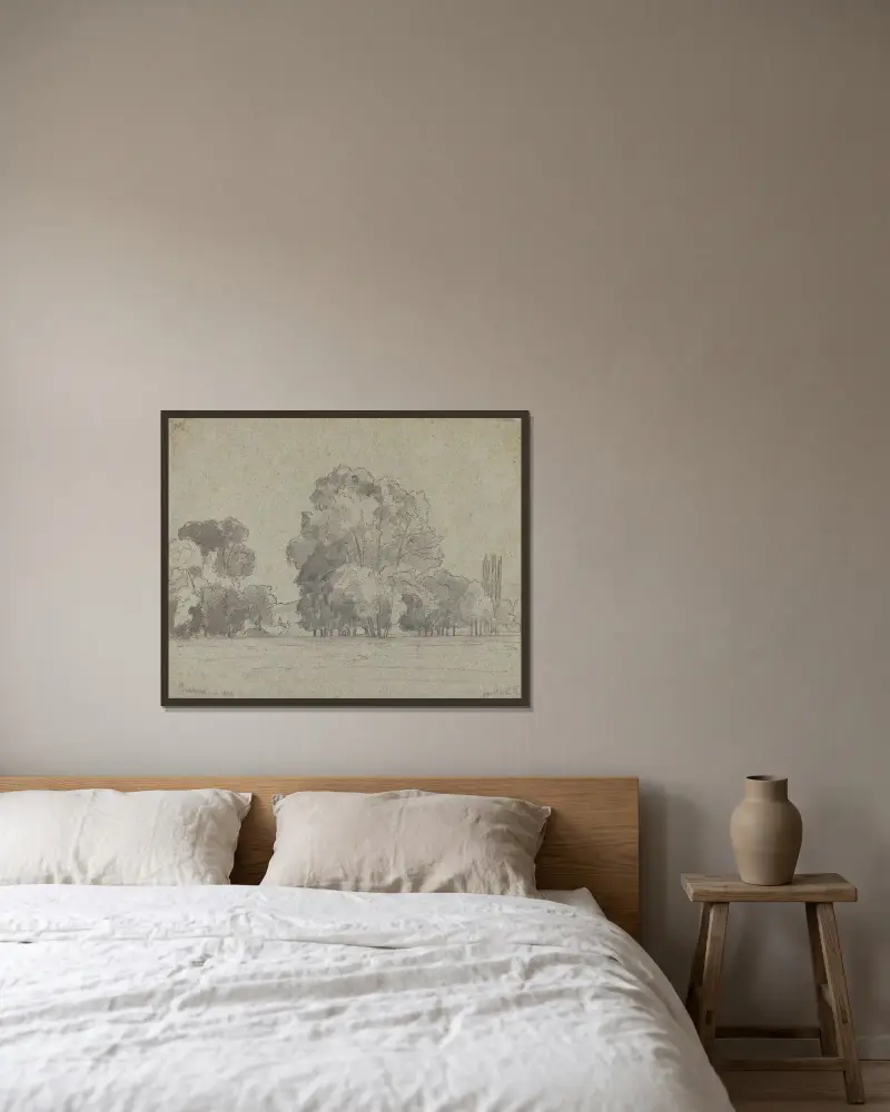 Träddunge av Camille Pissarro inramad på en vägg