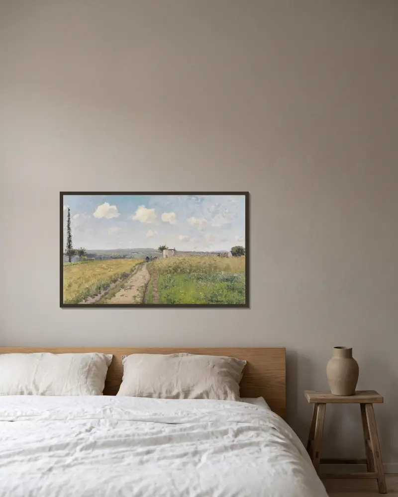 June morning near Pontoise av Camille Pissarro inramad på en vägg
