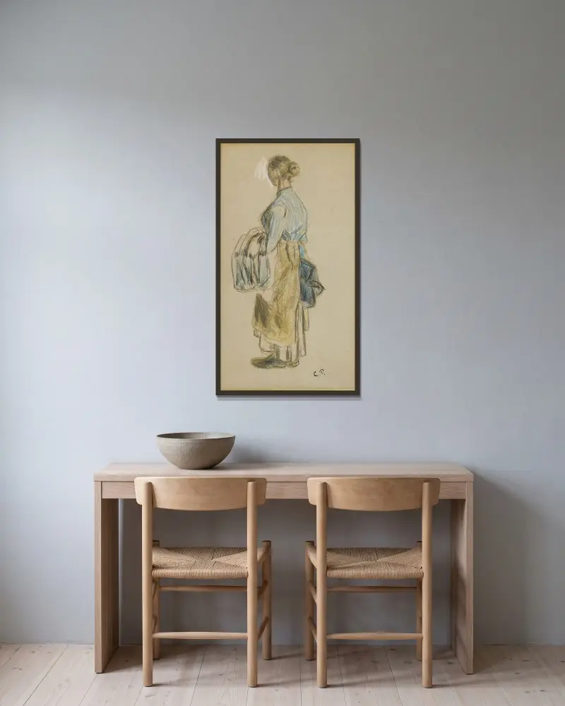 Laveuse av Camille Pissarro inramad på en vägg