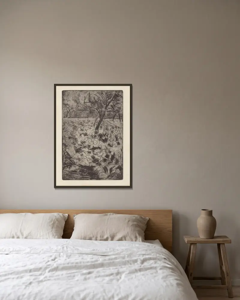 Le champ de choux av Camille Pissarro inramad på en vägg